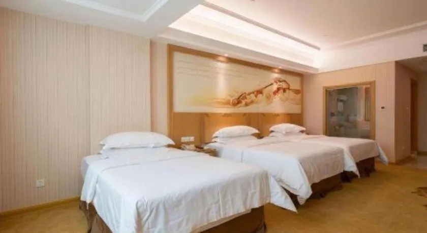 Bed in Vienna Hotel Guangzhou Huadu Sunac Cultural Tourism City Shiling