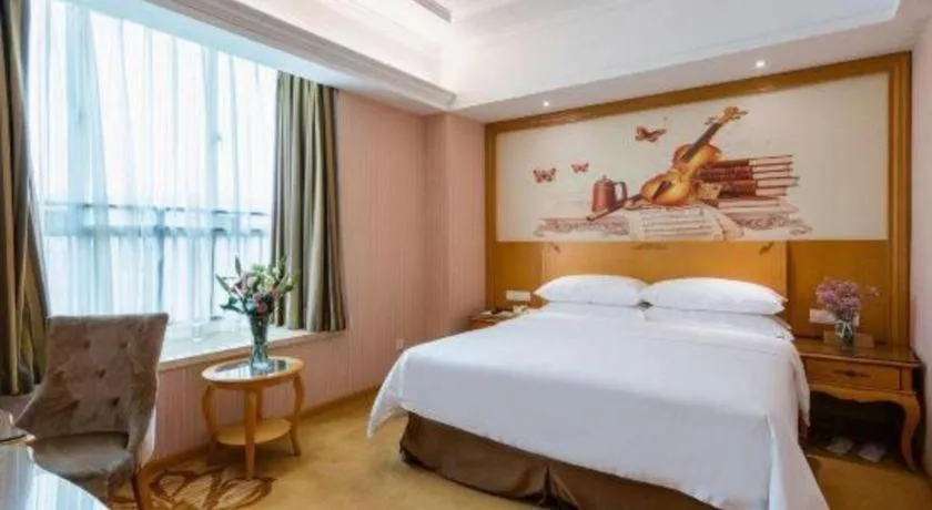 Bed in Vienna Hotel Guangzhou Huadu Sunac Cultural Tourism City Shiling