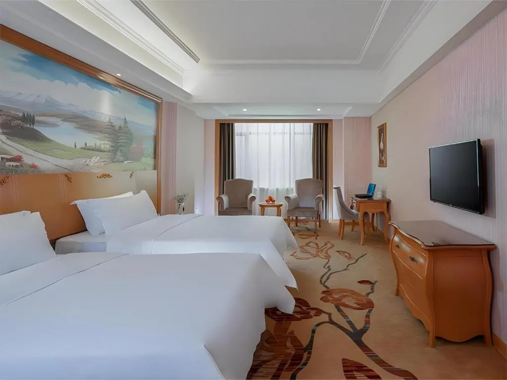 Bed in Vienna Hotel Guangzhou Huadu Sunac Cultural Tourism City Shiling