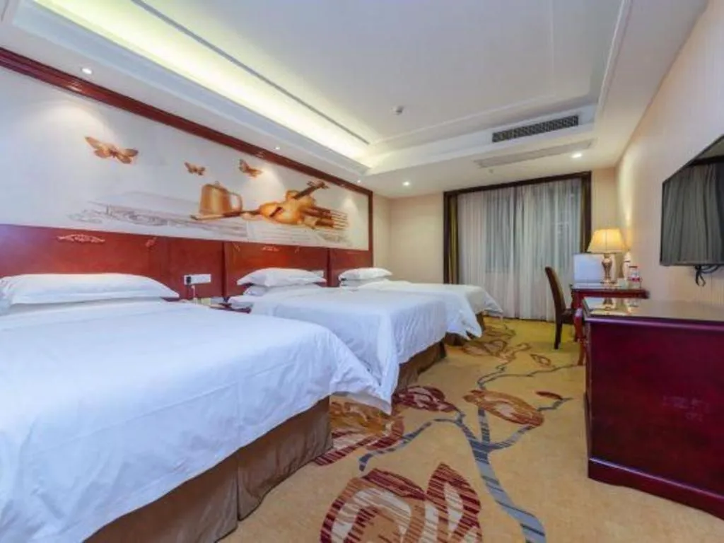 Bed in Vienna Hotel Guangzhou Huadu Sunac Cultural Tourism City Shiling
