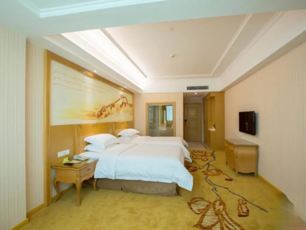 Bed in Vienna Hotel Guangzhou Huadu Sunac Cultural Tourism City Shiling