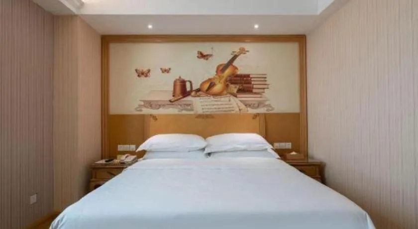 Bed in Vienna Hotel Guangzhou Huadu Sunac Cultural Tourism City Shiling