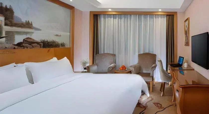 Bed in Vienna Hotel Guangzhou Huadu Sunac Cultural Tourism City Shiling