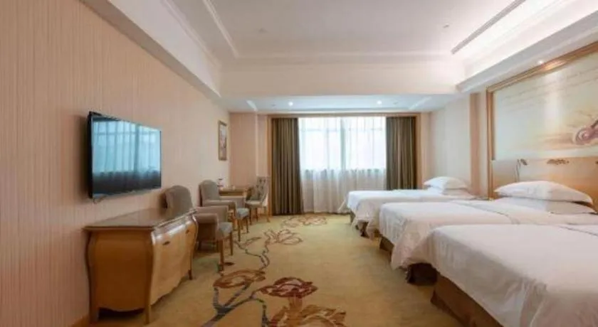 Bed in Vienna Hotel Guangzhou Huadu Sunac Cultural Tourism City Shiling