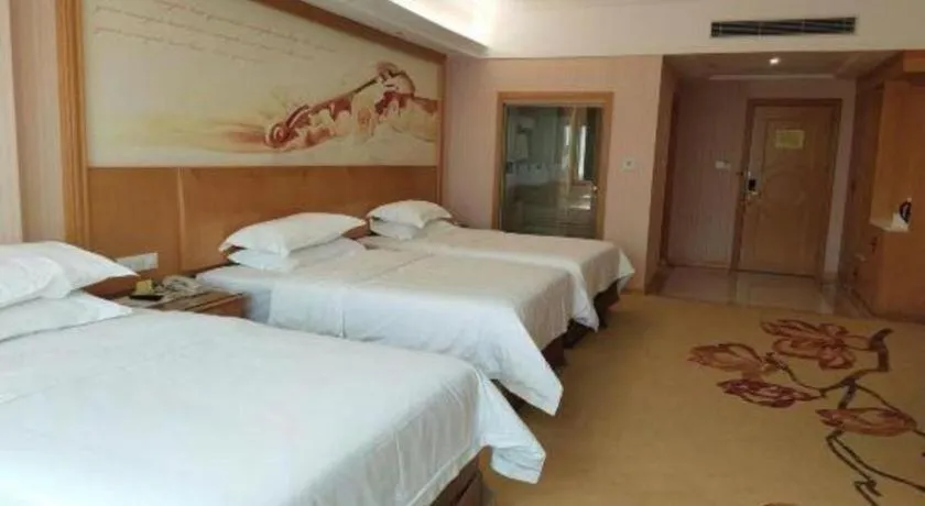 Bed in Vienna Hotel Guangzhou Huadu Sunac Cultural Tourism City Shiling