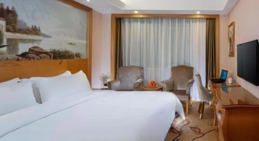 Bed in Vienna Hotel Guangzhou Huadu Sunac Cultural Tourism City Shiling