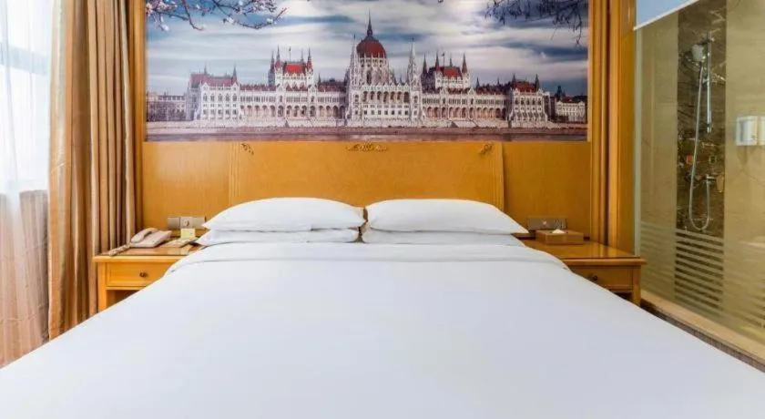 Bed in Vienna Hotel Hubei Xiangyang Tang City Gulou