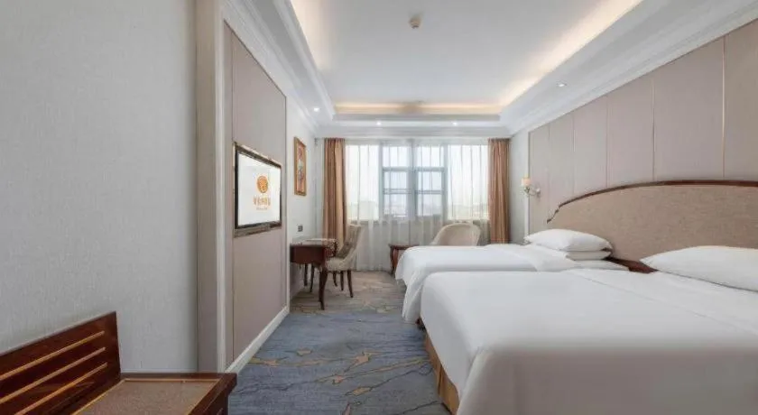 Bed in Vienna Hotel Guangzhou Baiyun College Jinyuan Plaza