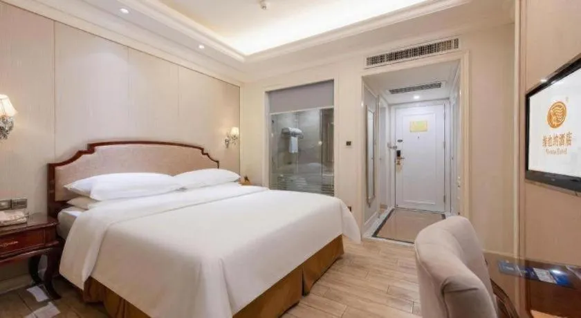 Bed in Vienna Hotel Guangzhou Baiyun College Jinyuan Plaza