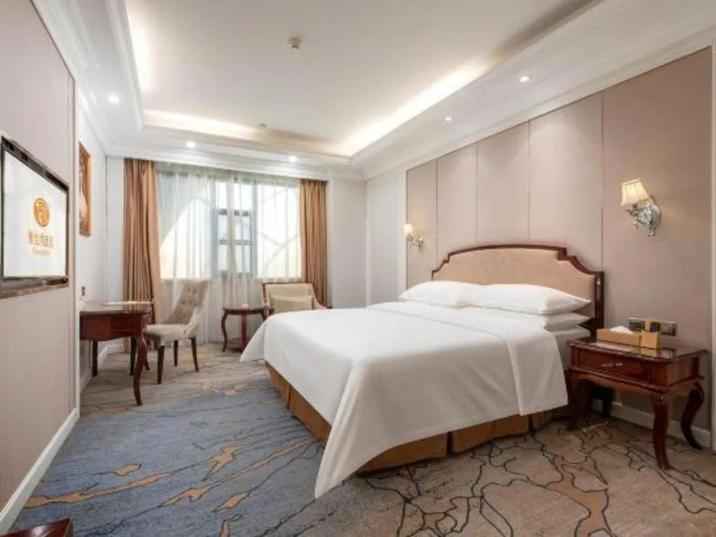 Bed in Vienna Hotel Guangzhou Baiyun College Jinyuan Plaza