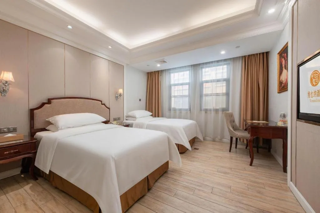 Bed in Vienna Hotel Guangzhou Baiyun College Jinyuan Plaza