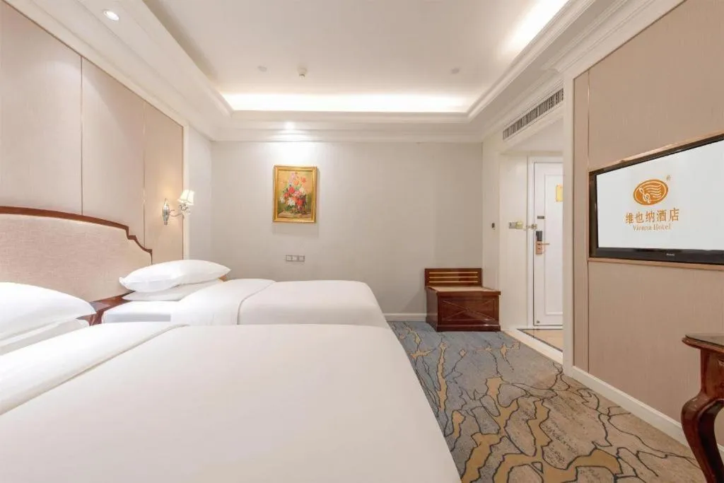Bed in Vienna Hotel Guangzhou Baiyun College Jinyuan Plaza
