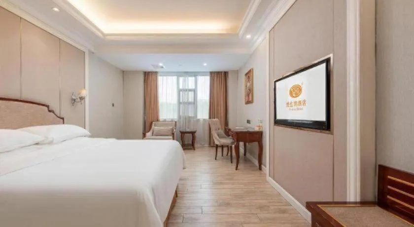 Bed in Vienna Hotel Guangzhou Baiyun College Jinyuan Plaza