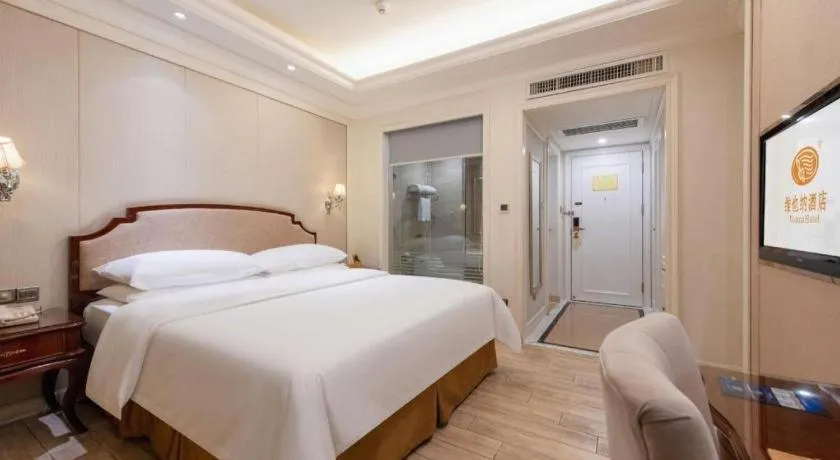 Bed in Vienna Hotel Guangzhou Baiyun College Jinyuan Plaza