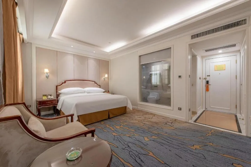 Bed in Vienna Hotel Guangzhou Baiyun College Jinyuan Plaza