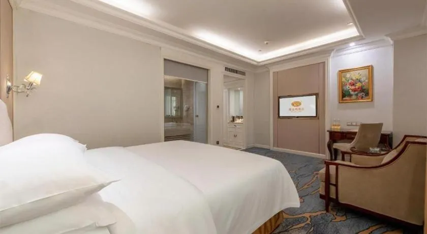 Bed in Vienna Hotel Guangzhou Baiyun College Jinyuan Plaza