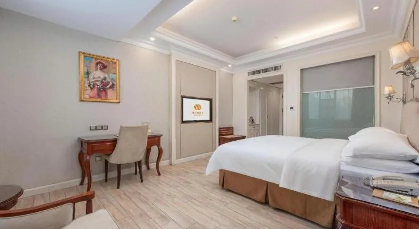 Bed in Vienna Hotel Guangzhou Baiyun College Jinyuan Plaza