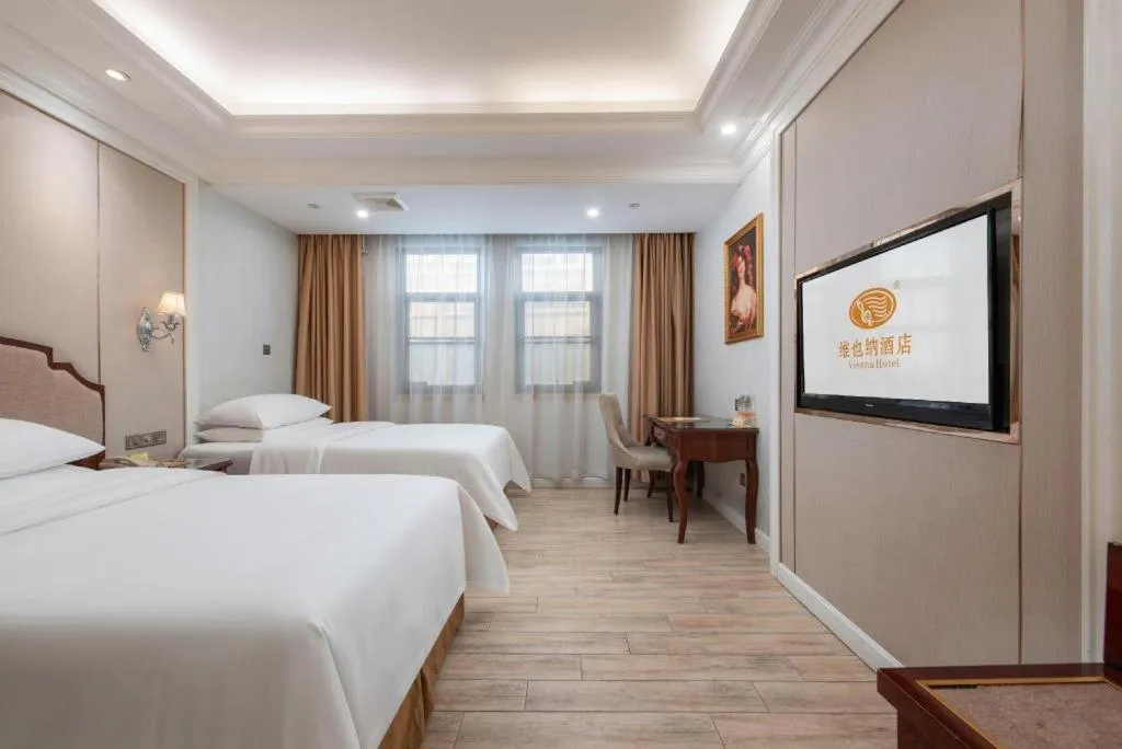 Bed in Vienna Hotel Guangzhou Baiyun College Jinyuan Plaza