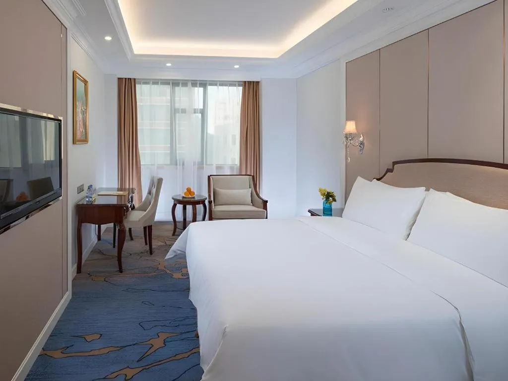 Bed in Vienna Hotel Guangzhou Baiyun College Jinyuan Plaza