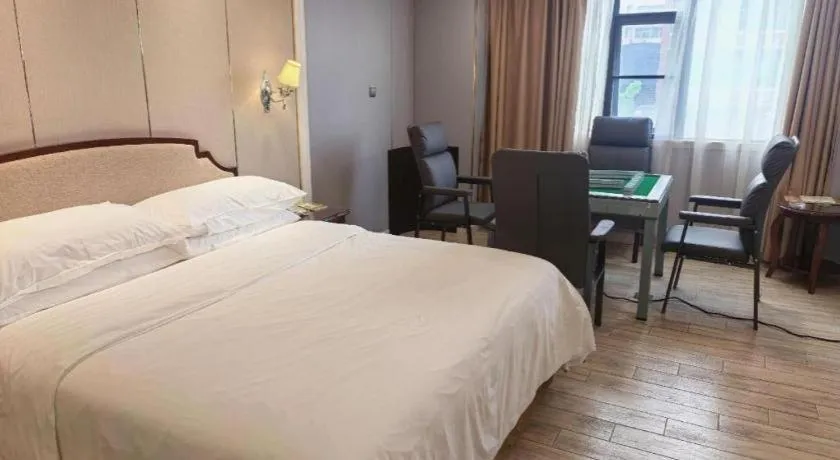 Bed in Vienna Hotel Guangzhou Baiyun College Jinyuan Plaza