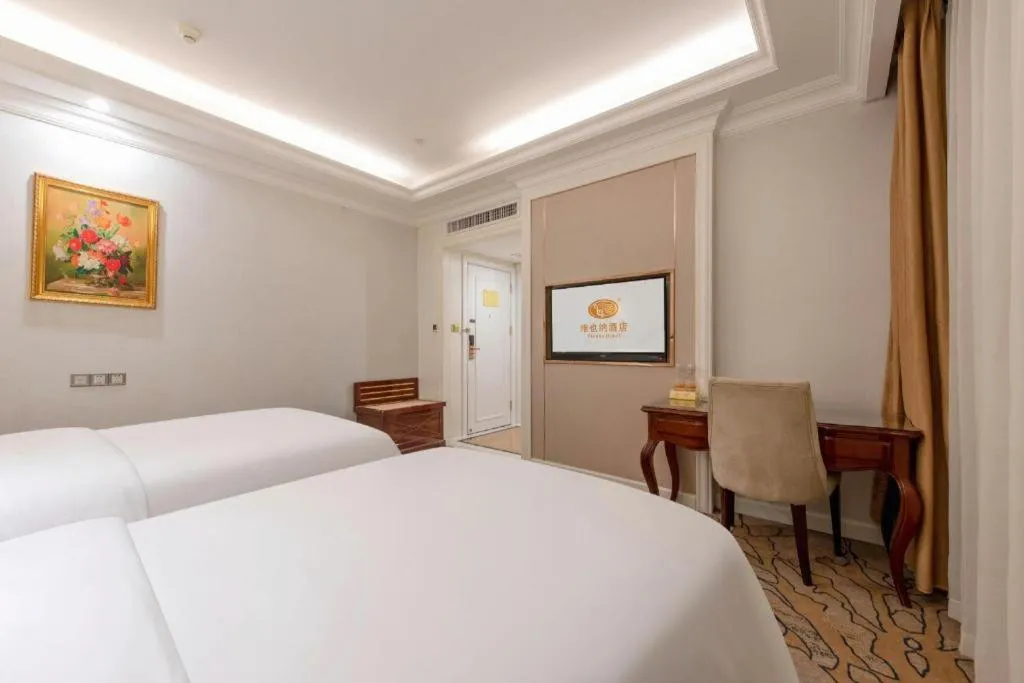 Bed in Vienna Hotel Guangzhou Baiyun College Jinyuan Plaza