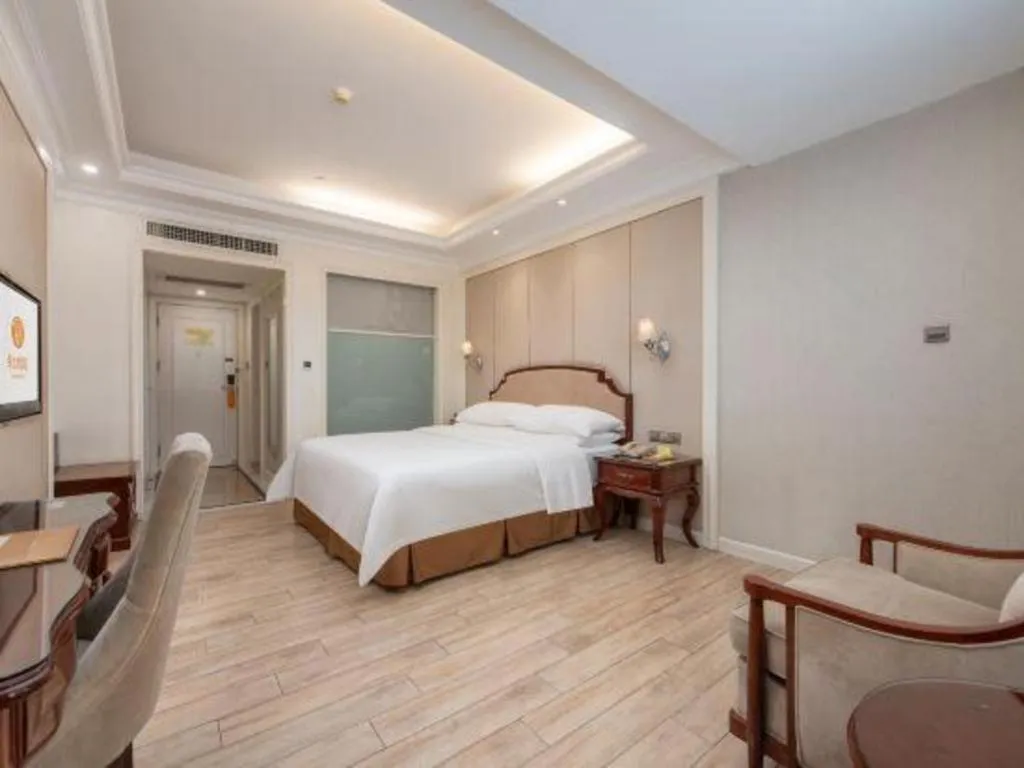 Bed in Vienna Hotel Guangzhou Baiyun College Jinyuan Plaza
