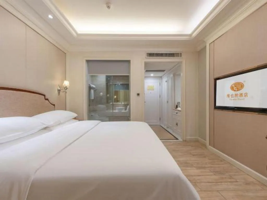 Bed in Vienna Hotel Guangzhou Baiyun College Jinyuan Plaza
