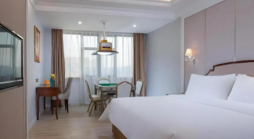 Bed in Vienna Hotel Guangzhou Baiyun College Jinyuan Plaza