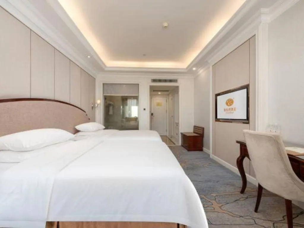 Bed in Vienna Hotel Guangzhou Baiyun College Jinyuan Plaza