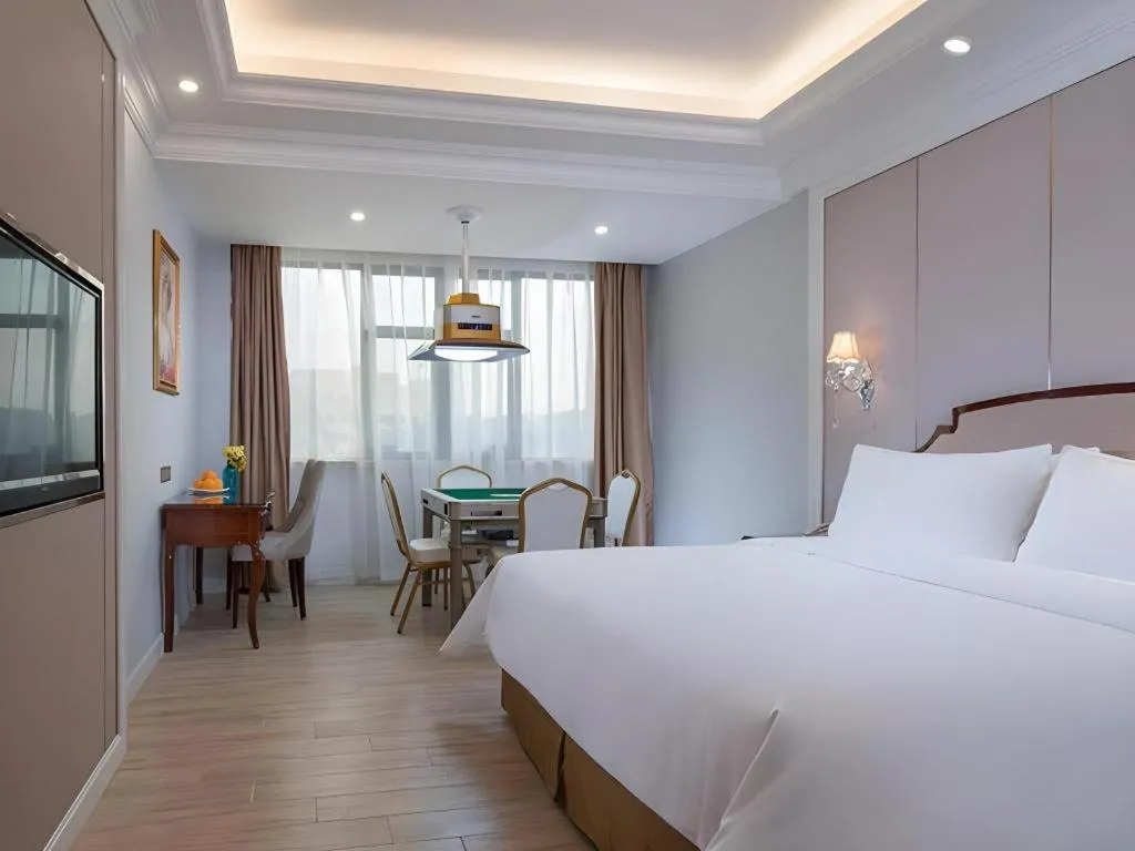 Bed in Vienna Hotel Guangzhou Baiyun College Jinyuan Plaza