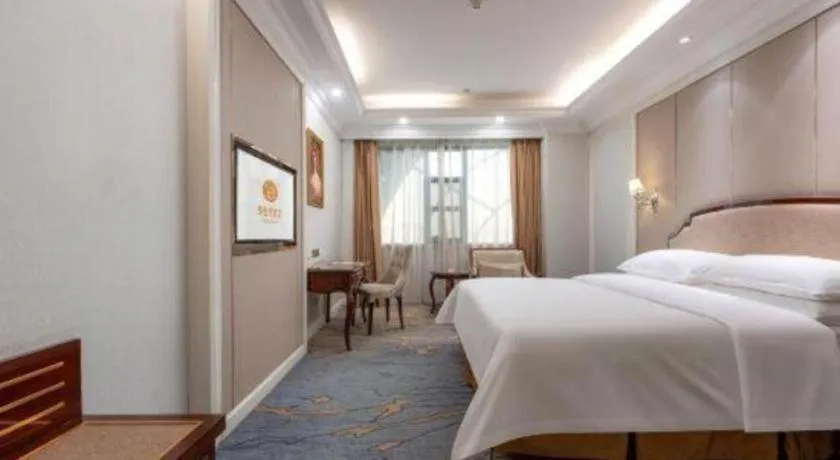 Bed in Vienna Hotel Guangzhou Baiyun College Jinyuan Plaza