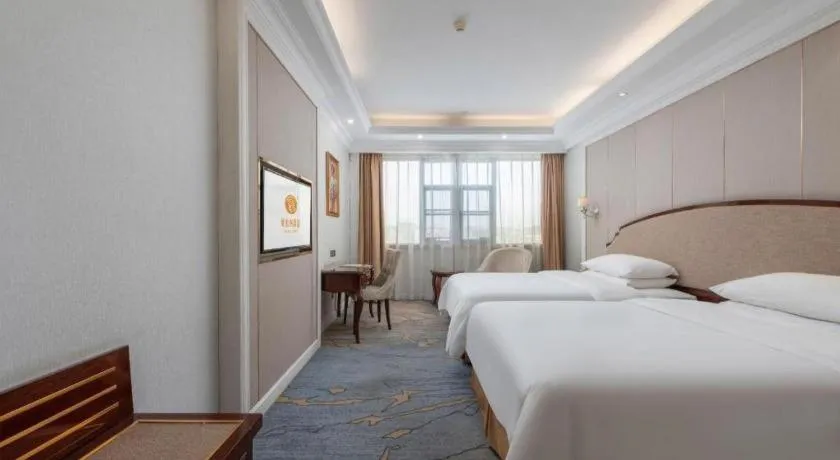 Bed in Vienna Hotel Guangzhou Baiyun College Jinyuan Plaza