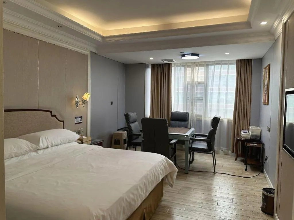 Bed in Vienna Hotel Guangzhou Baiyun College Jinyuan Plaza