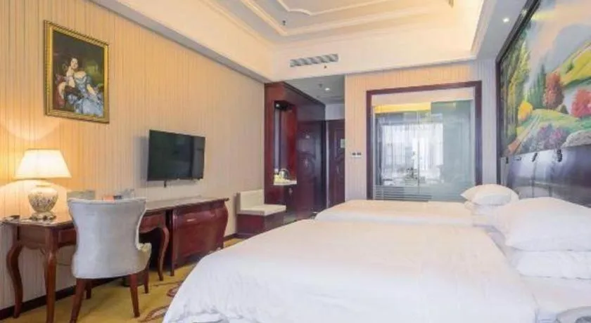 Bed in Vienna Hotel Jiangxi Ji'an Anfu