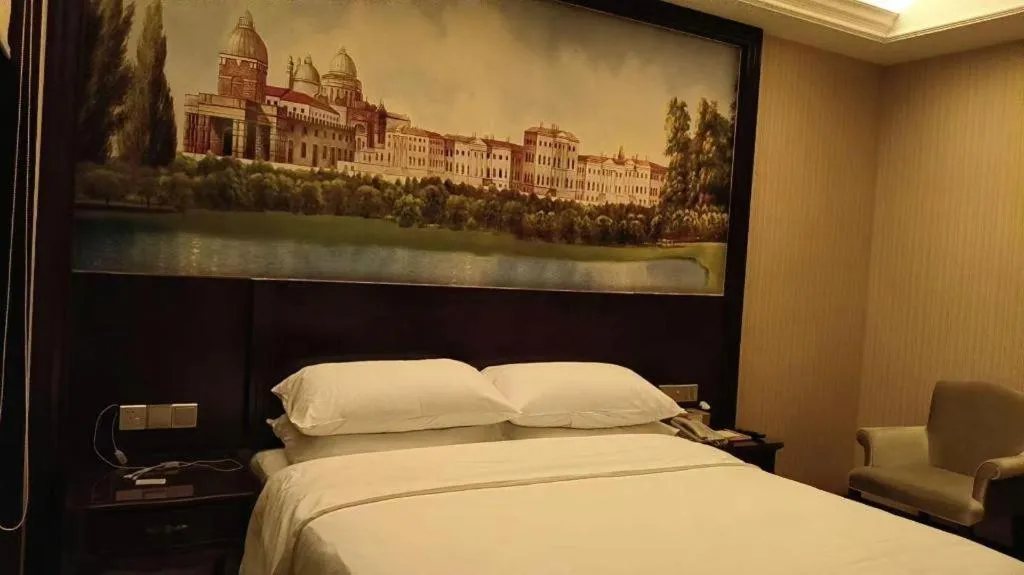 Bed in Vienna Hotel Jiangxi Ji'an Anfu