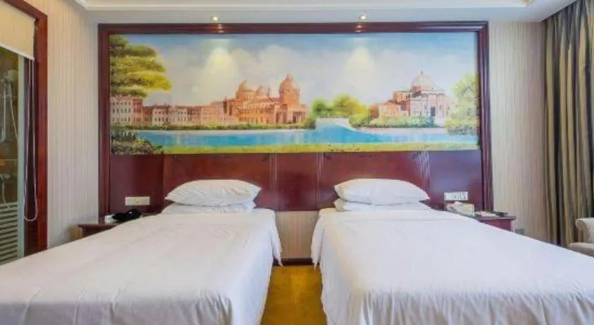 Bed in Vienna Hotel Jiangxi Ji'an Anfu