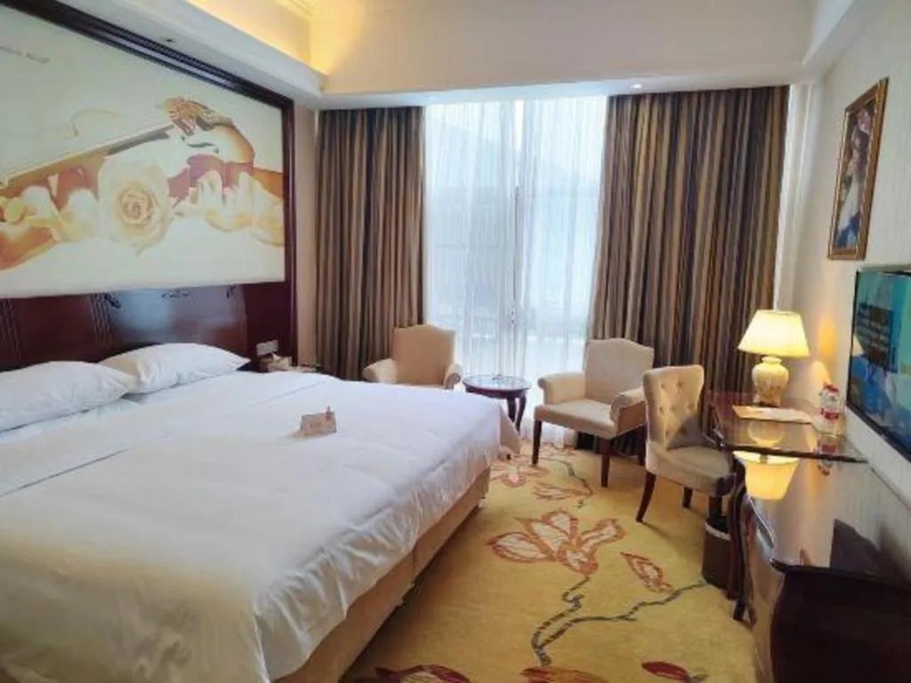 Bed in Vienna Hotel Jiangxi Ji'an Anfu