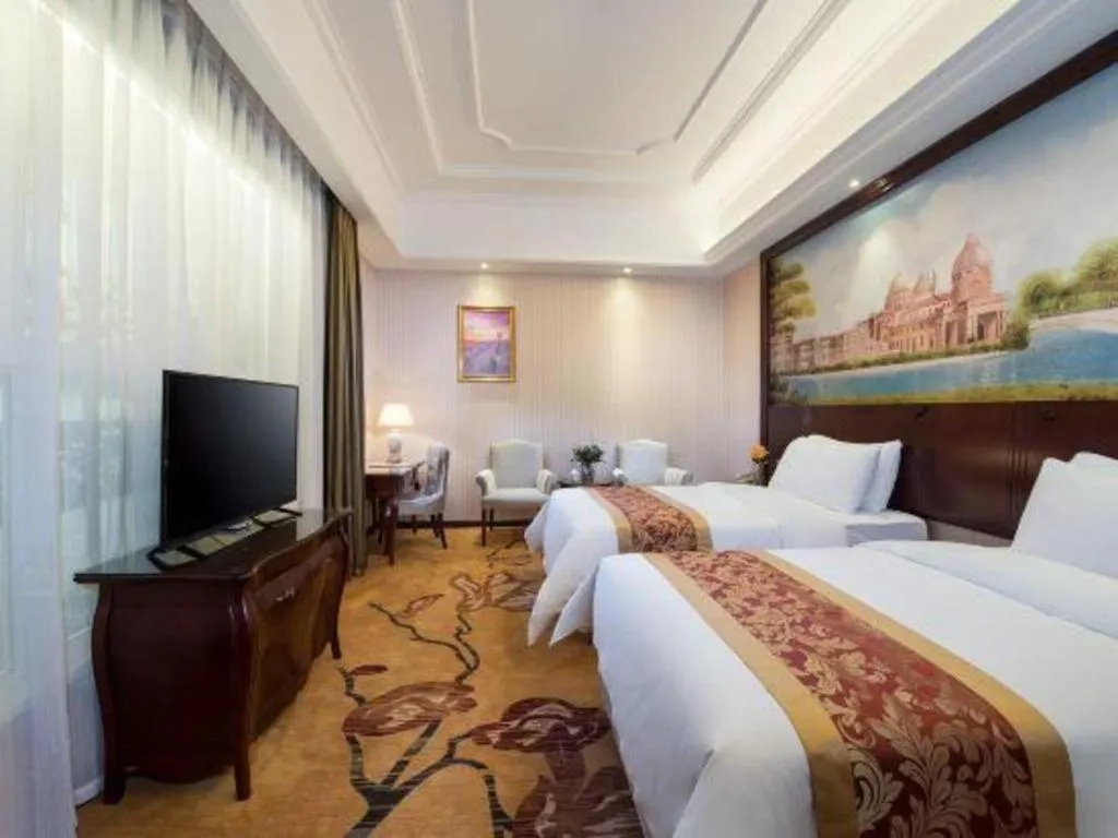 Bed in Vienna Hotel Jiangxi Ji'an Anfu