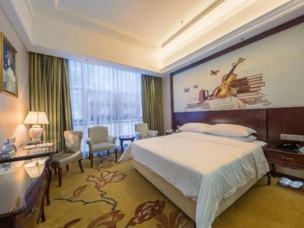 Bed in Vienna Hotel Jiangxi Ji'an Anfu