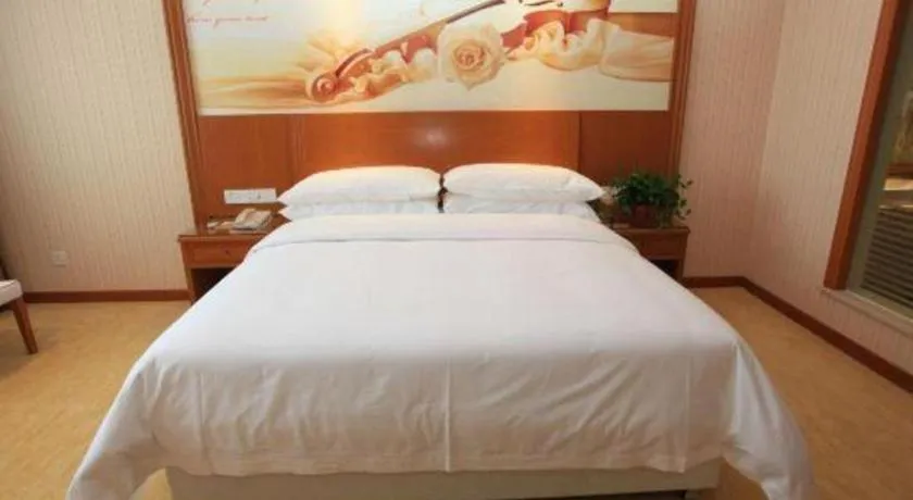 Bed in Vienna Hotel Jiangxi Ji'an Anfu