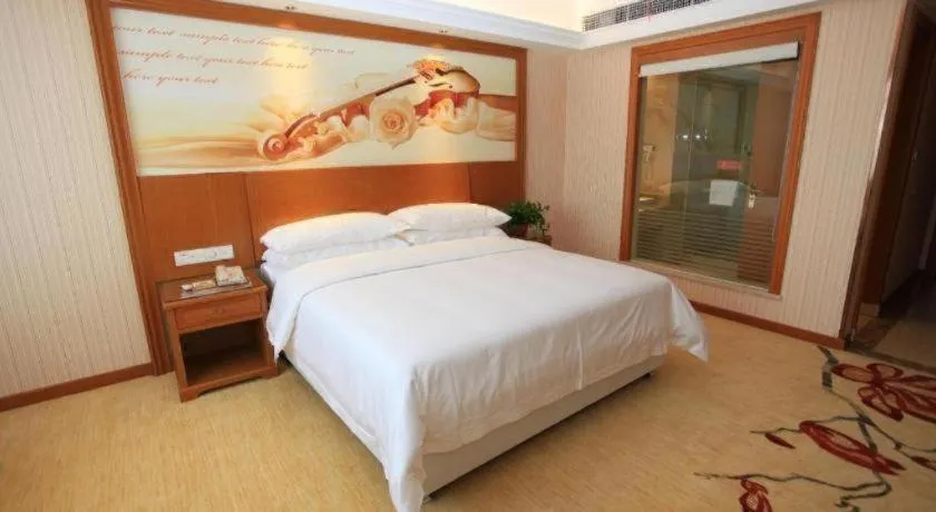 Bed in Vienna Hotel Jiangxi Ji'an Anfu