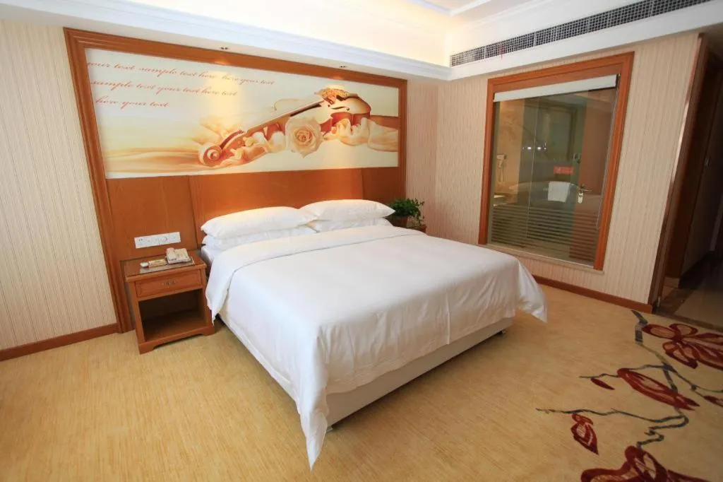 Bed in Vienna Hotel Jiangxi Ji'an Anfu