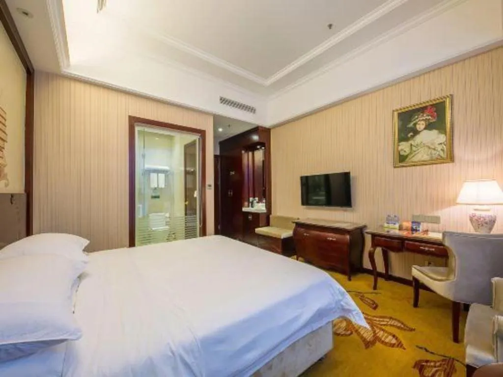 Bed in Vienna Hotel Jiangxi Ji'an Anfu