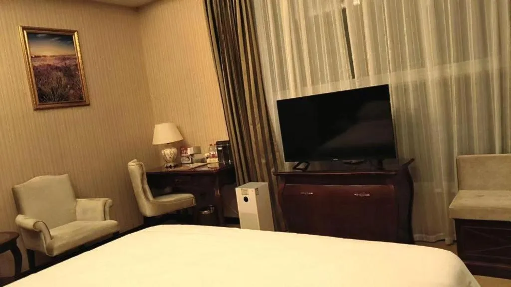 Bed in Vienna Hotel Jiangxi Ji'an Anfu