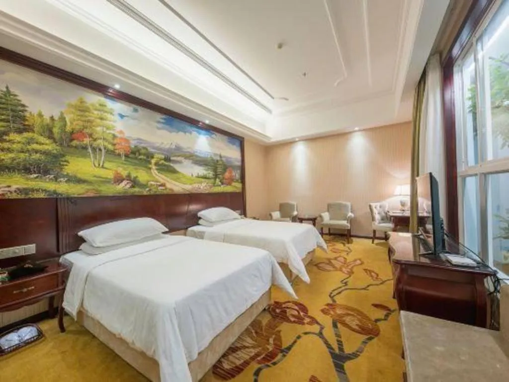 Bed in Vienna Hotel Jiangxi Ji'an Anfu