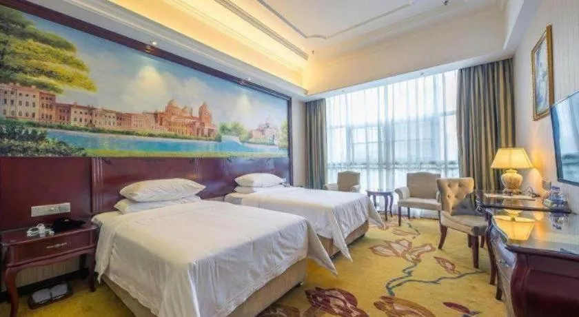 Bed in Vienna Hotel Jiangxi Ji'an Anfu