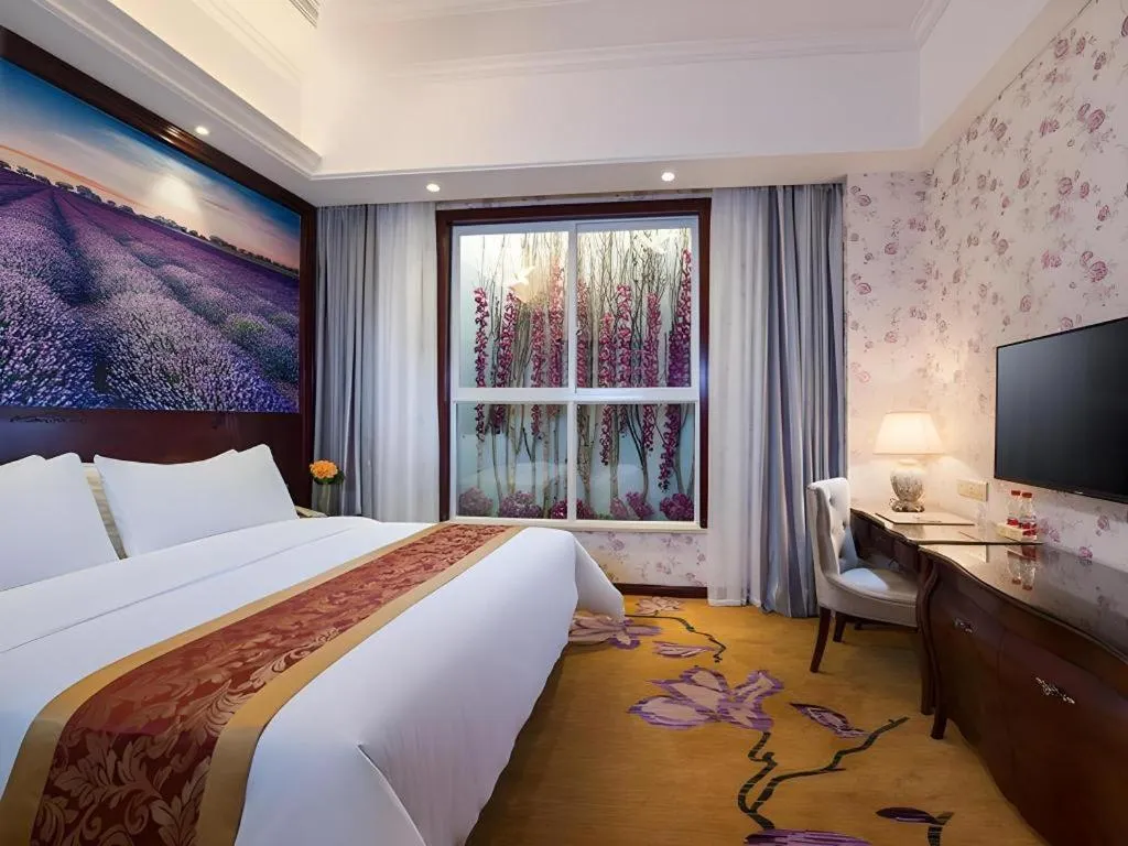 Bed in Vienna Hotel Jiangxi Ji'an Anfu