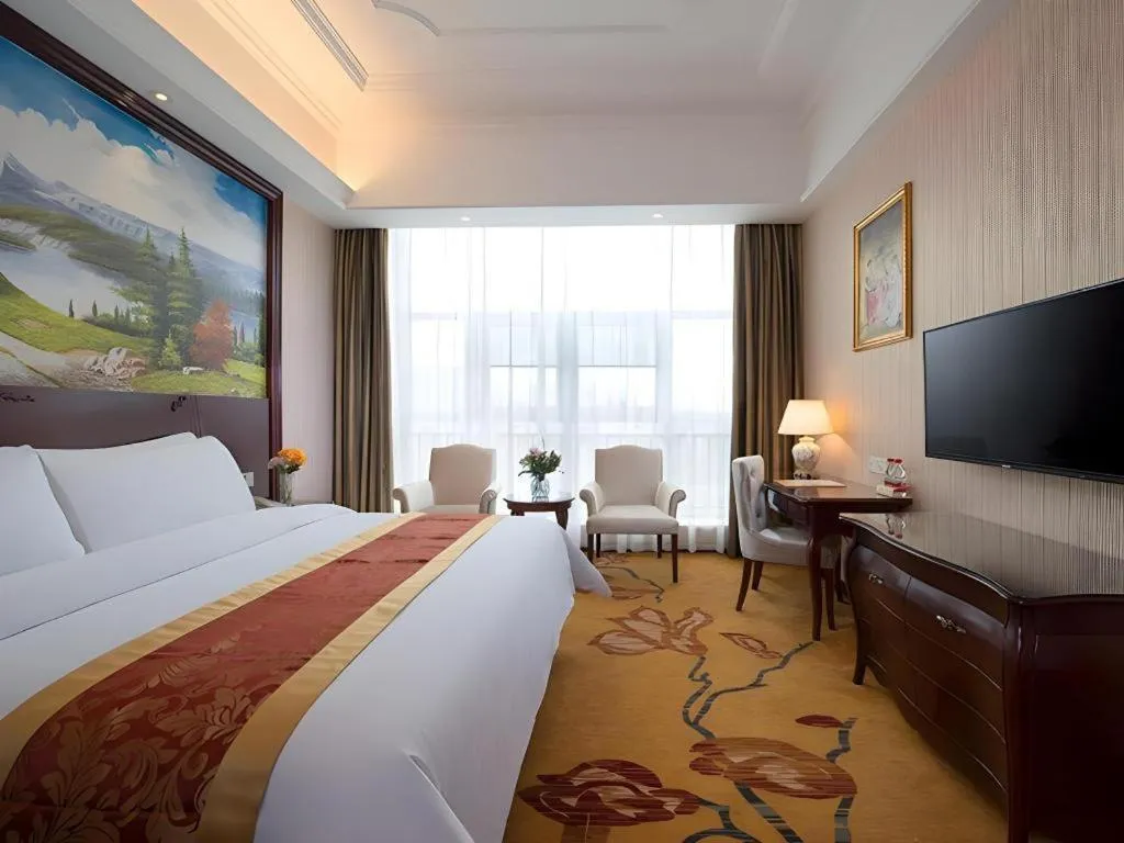 Bed in Vienna Hotel Jiangxi Ji'an Anfu