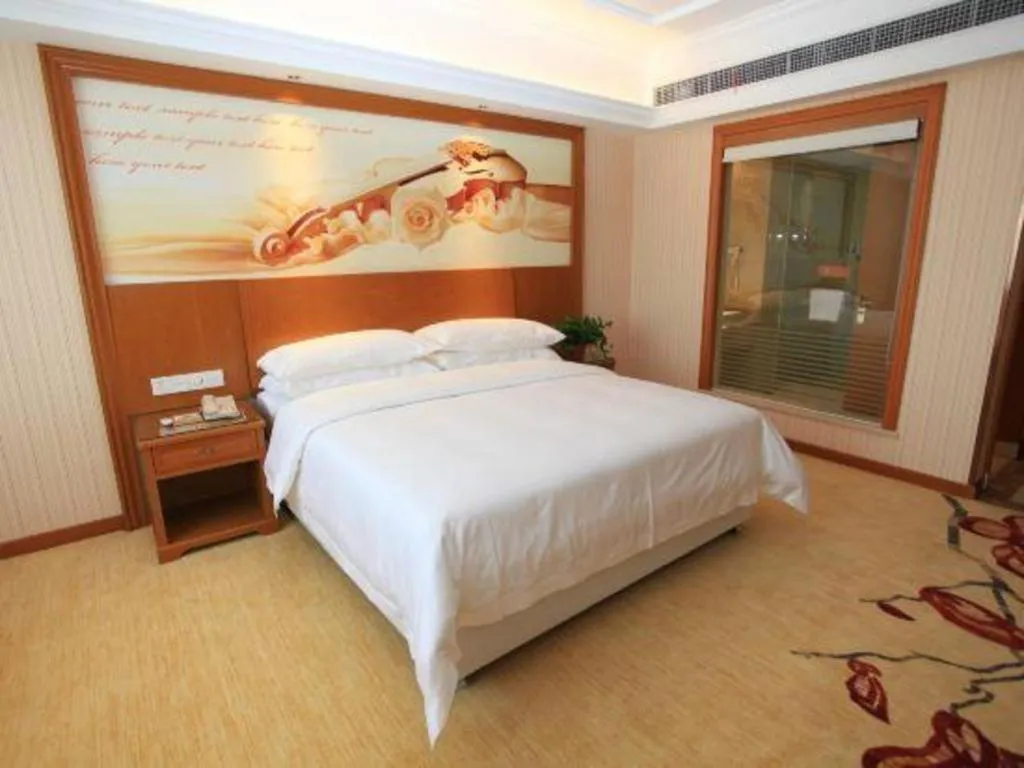 Bed in Vienna Hotel Jiangxi Ji'an Anfu