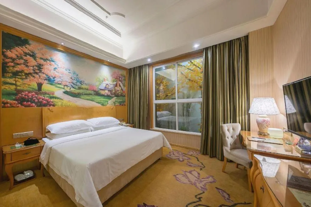 Bed in Vienna Hotel Jiangxi Ji'an Anfu